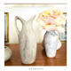 2 jugs in rough cut stone