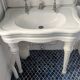 Set of a sink and its retro ceramic splashback.