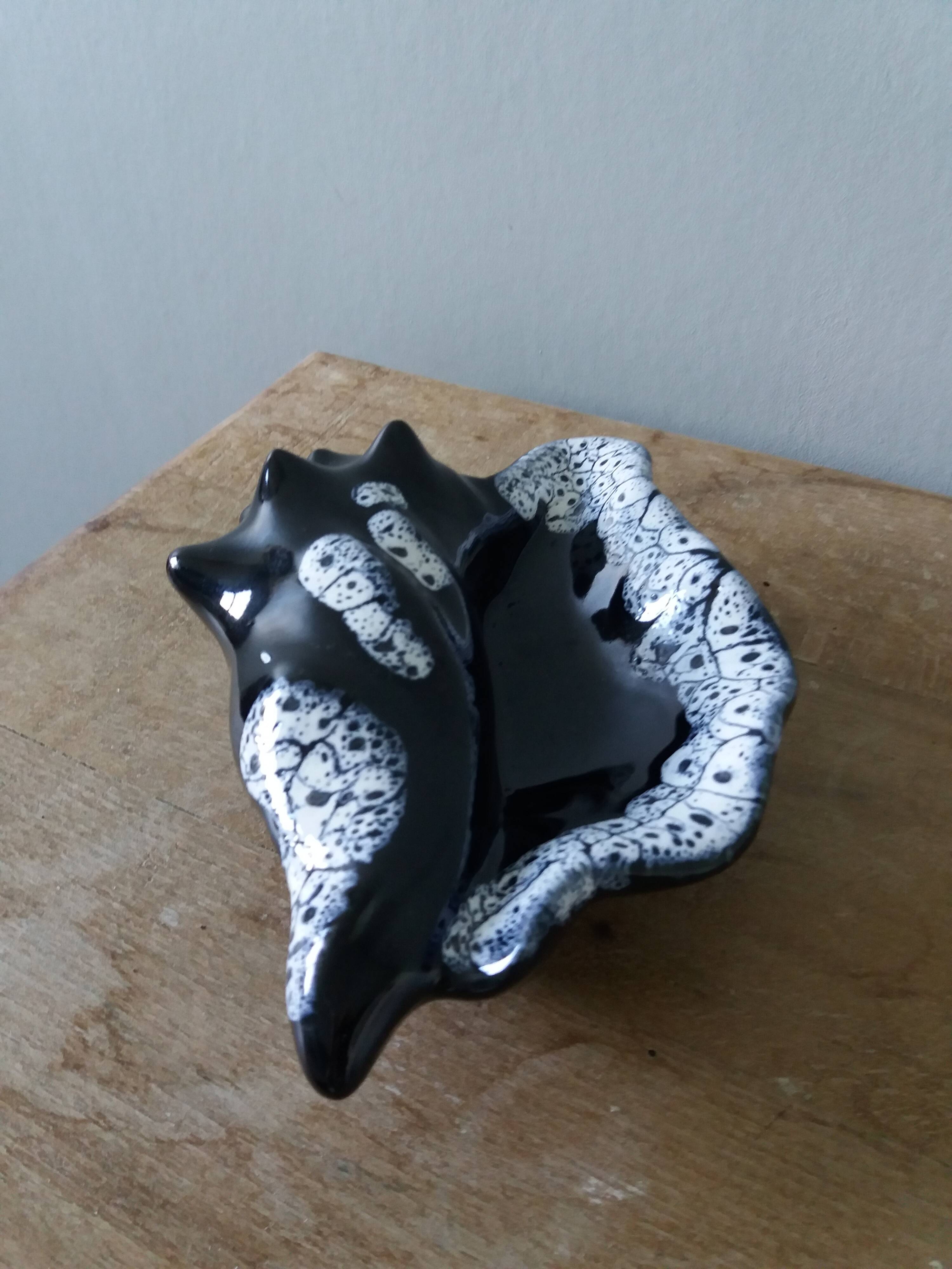 Black ceramic and foam shell ashtray