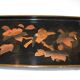 Set of two brown and black Chinese lacquer trays with bird decor