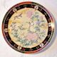 Vintage Japanese decorative plate with chrysanthemum and bird patterns.