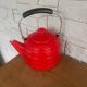 Old red enameled kettle