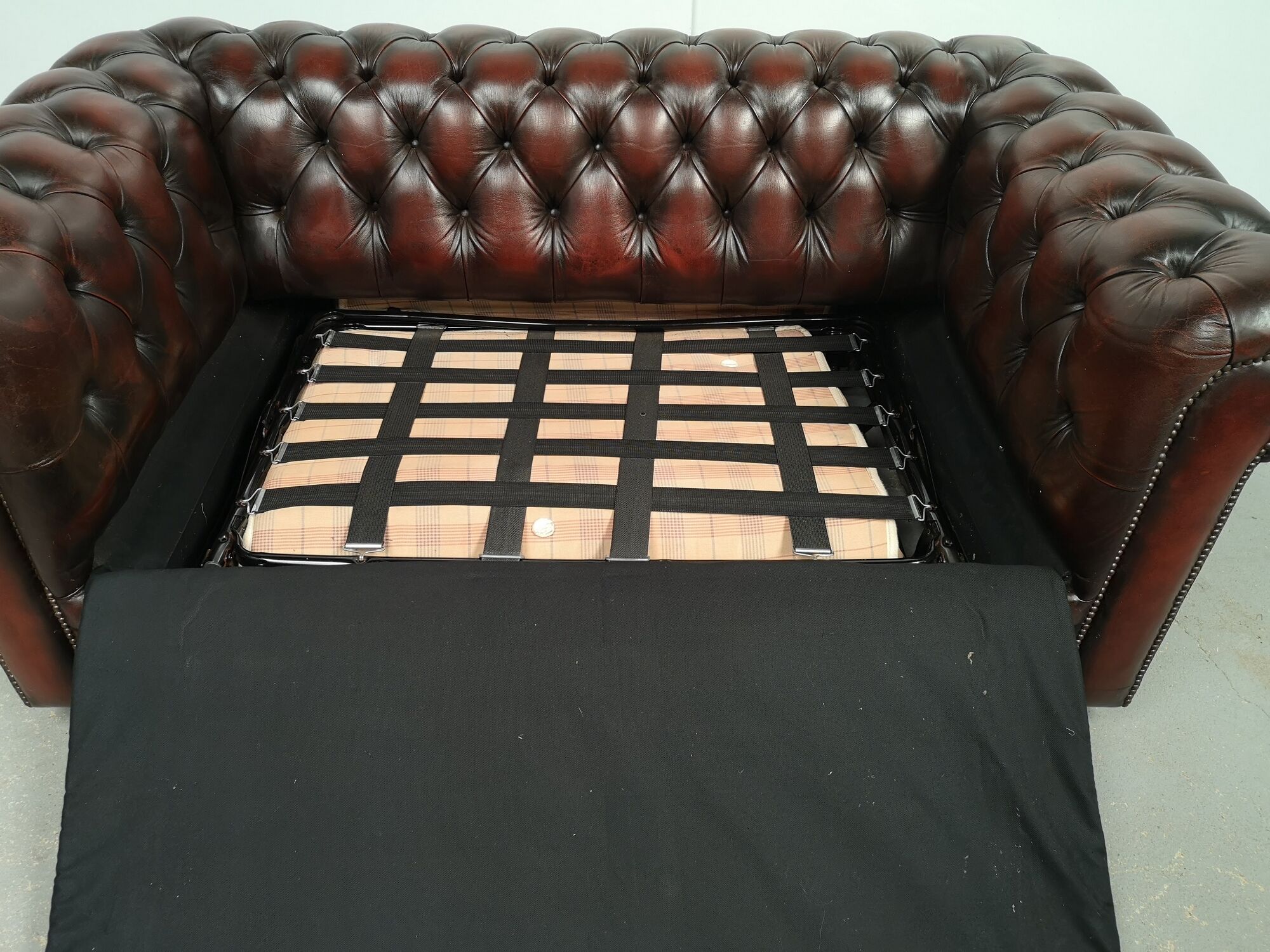 Convertible leather chesterfield sofa