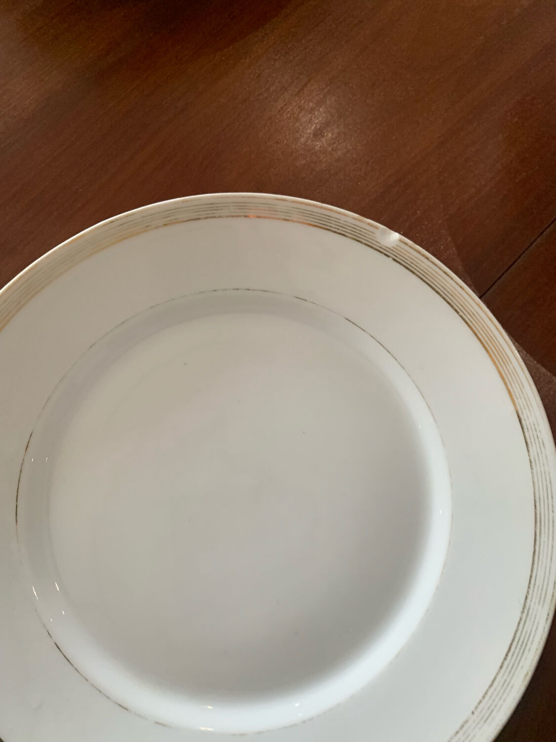 Lot of six flat plates, crockery, old white, gilded