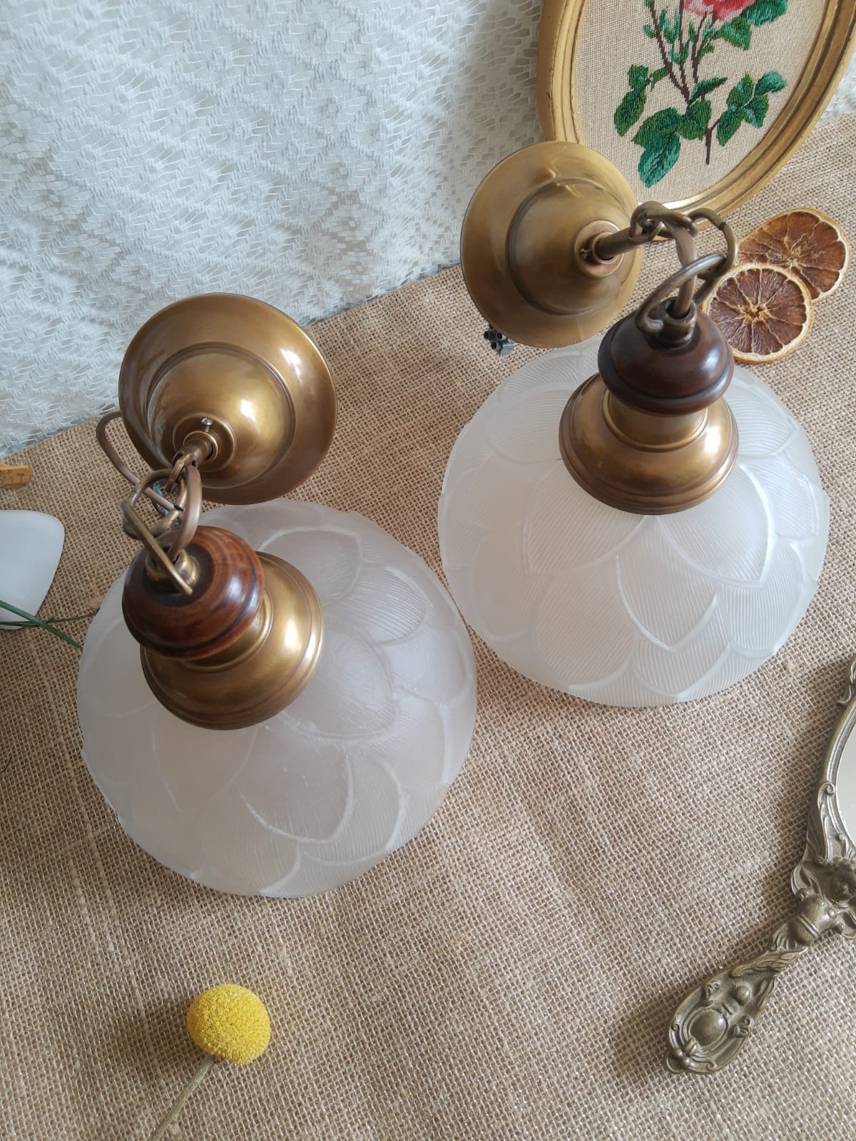 Pair of frosted glass flower pendant lights with vintage wood and brass