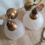 Pair of frosted glass flower pendant lights with vintage wood and brass