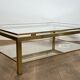 Modernist coffee table in brass and glass tops by Guy Lefèvre for Maison Jansen.