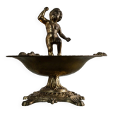 Vintage brass ashtray from the 1940s with a nude boy figurine on a footed base.