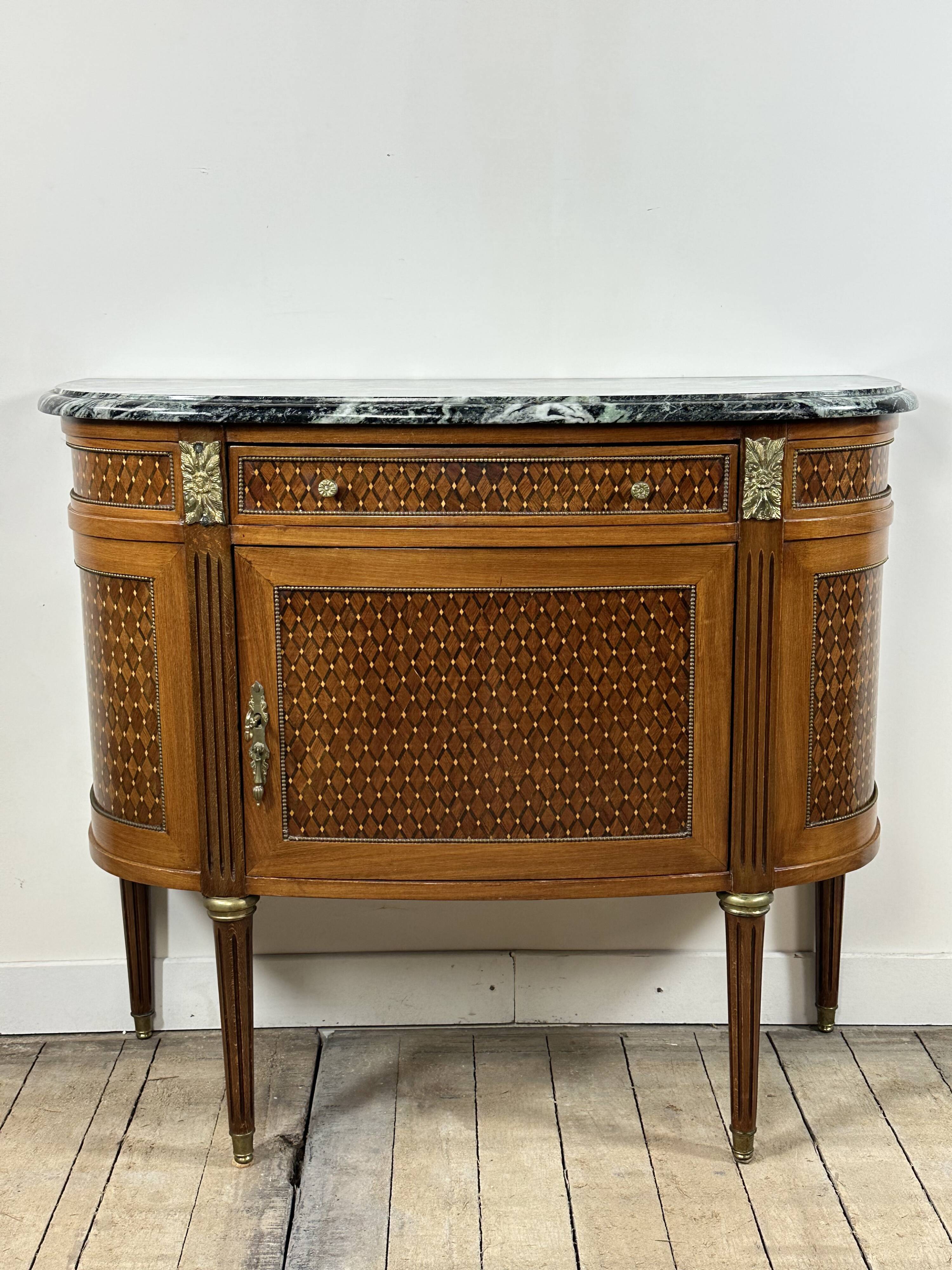 Half-moon commode in the Louis XVI style