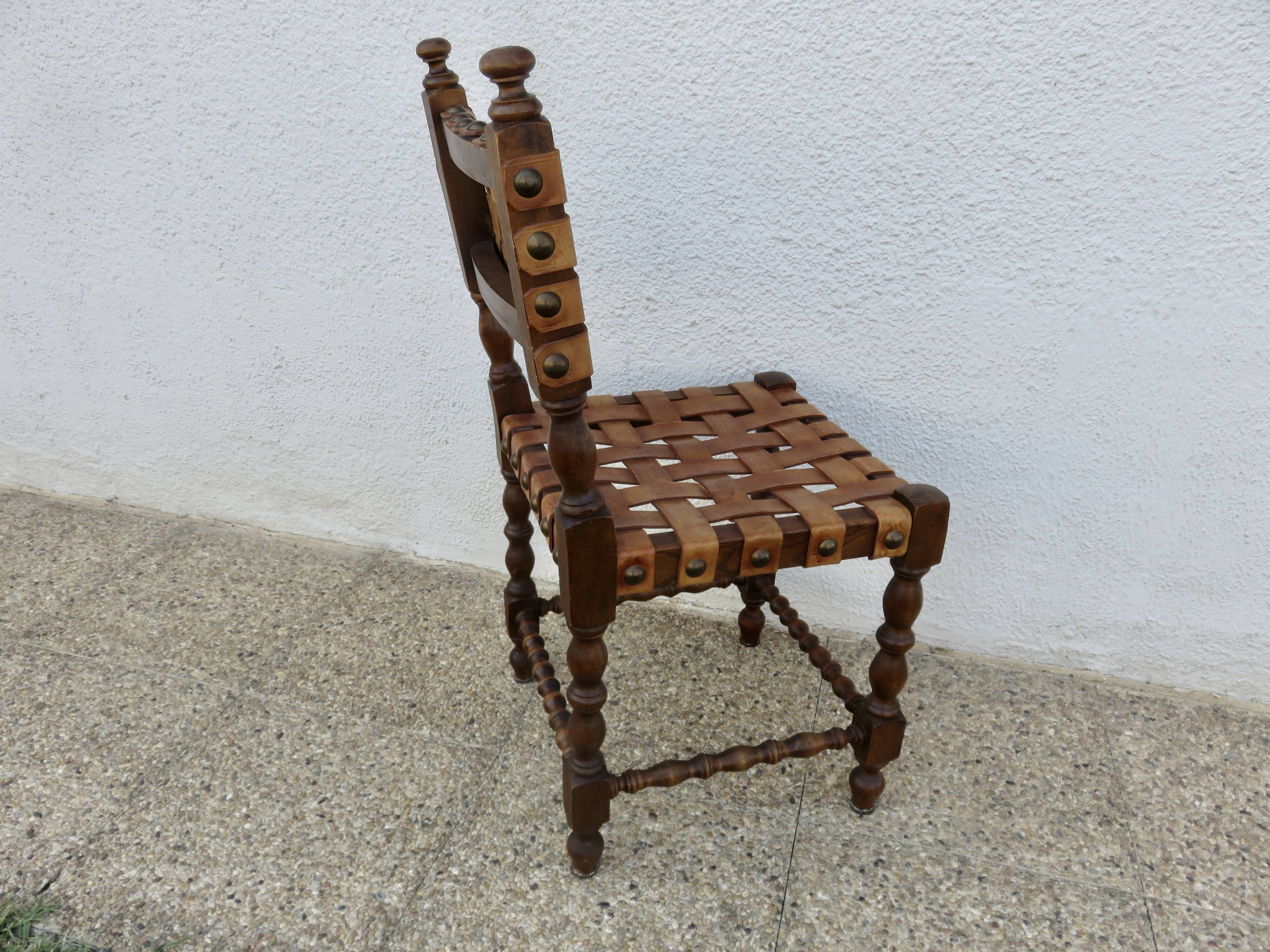 Spanish chair in oak with thick cognac leather straps, 1940s.