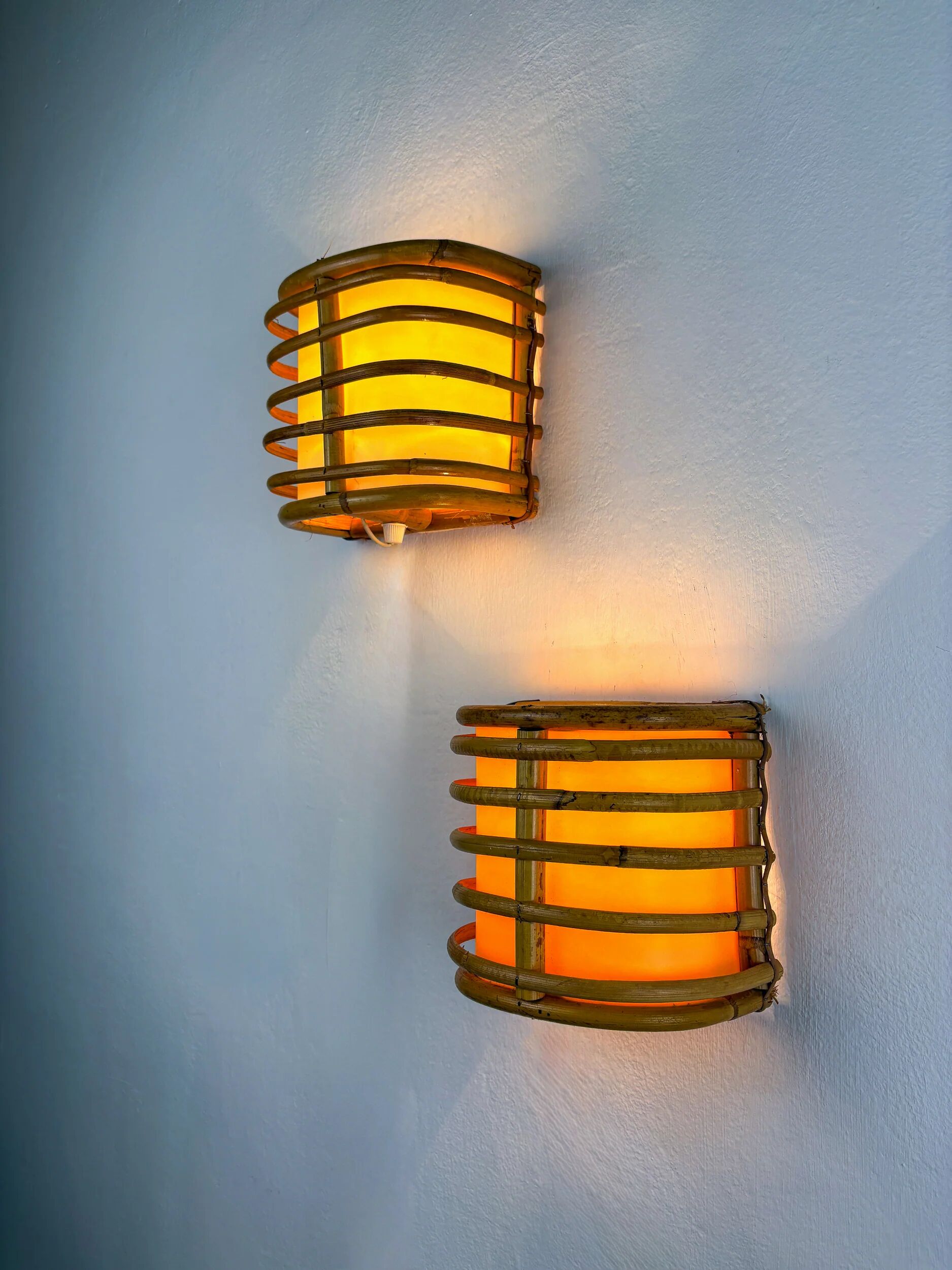 Pair of mid-century rattan wall sconces, 1960s, Italy