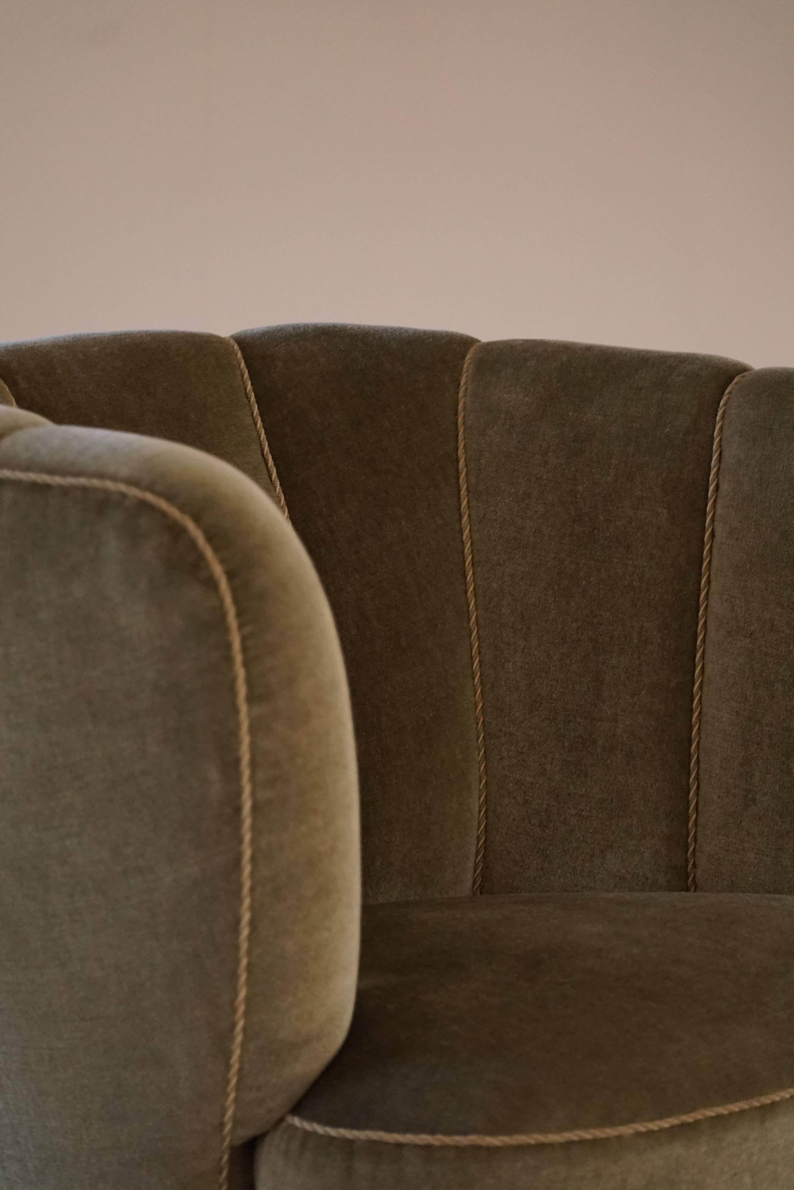 Curved Danish club chair from the mid-century, in the style of Viggo Boesen, 1940s.