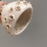 Ceramic hanging lamp in creamy white color that almost looks like a corral