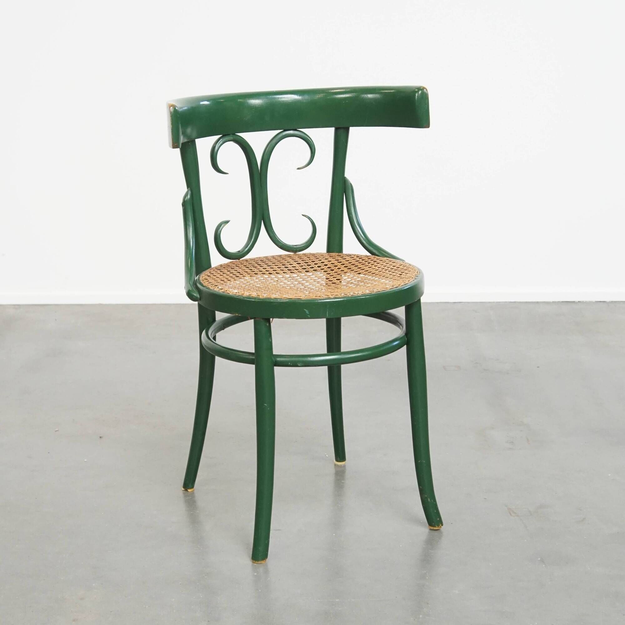 Vintage green bistro chair with woven reed seat