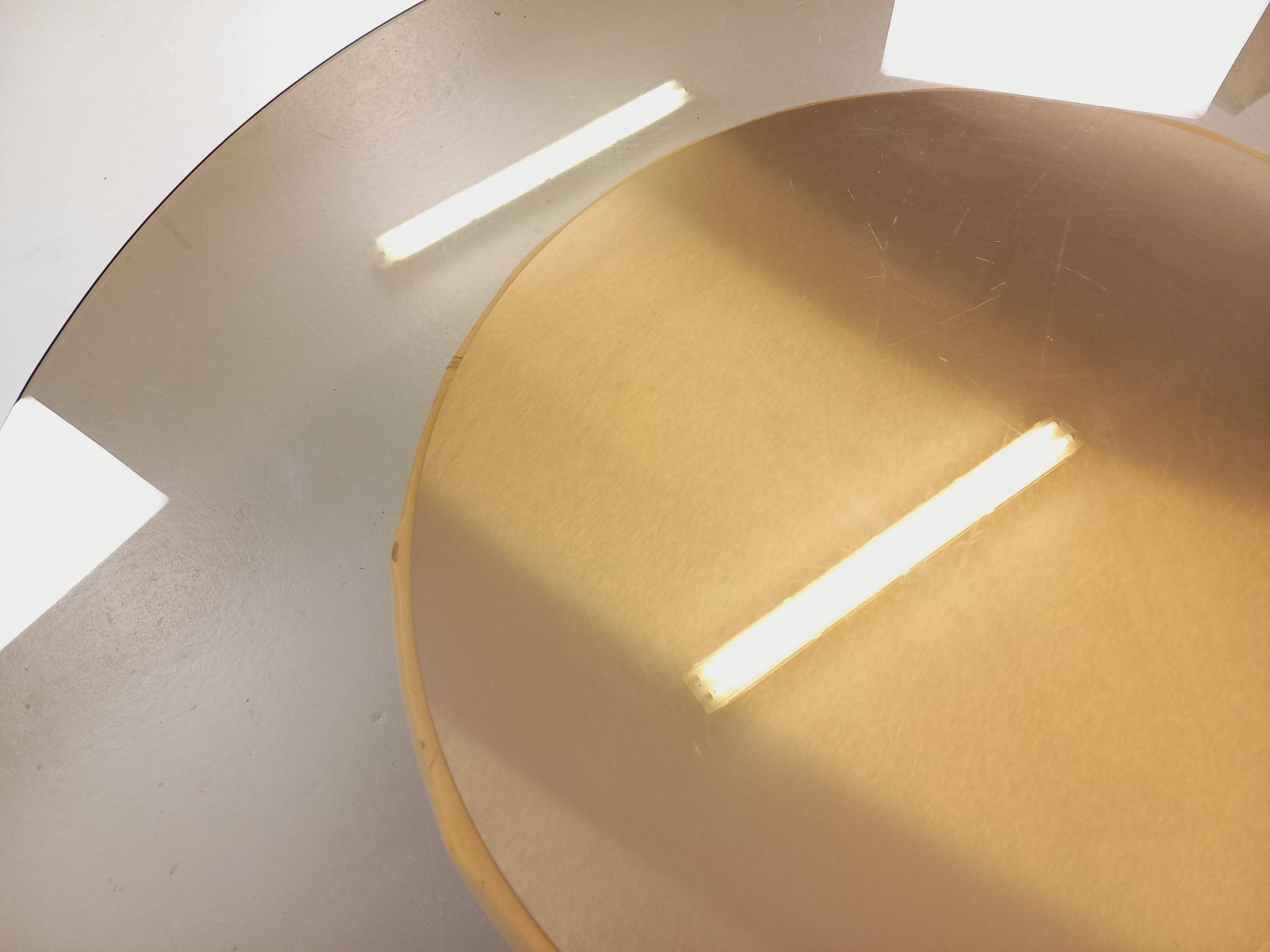 Vintage round coffee table in glass, leather, and metal in Space Age style from the 70s.
