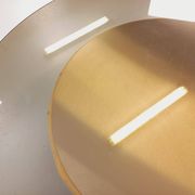 Vintage round coffee table in glass, leather, and metal in Space Age style from the 70s.