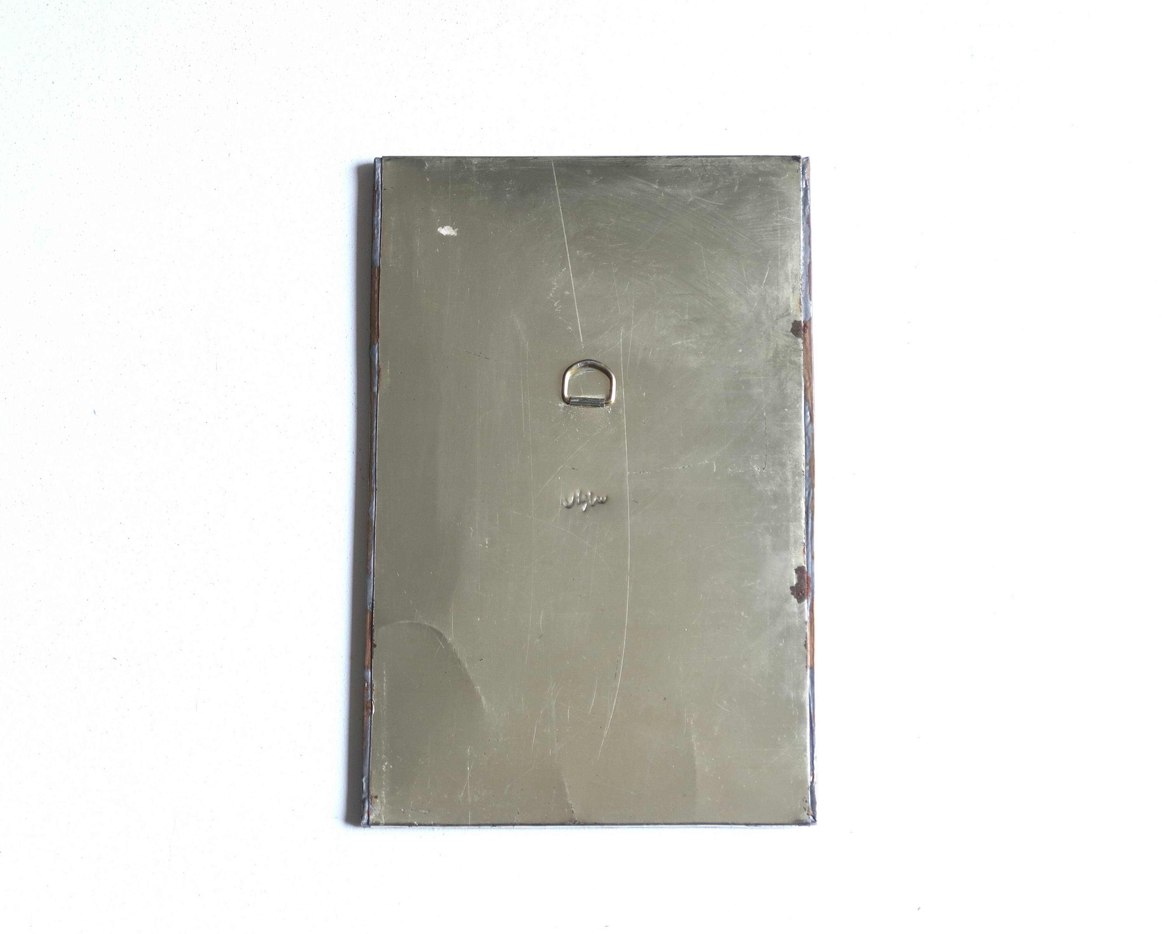 Rectangular Moroccan mirror in brass resembling a door, 1970s.