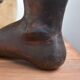 Carved wooden Buddha's foot