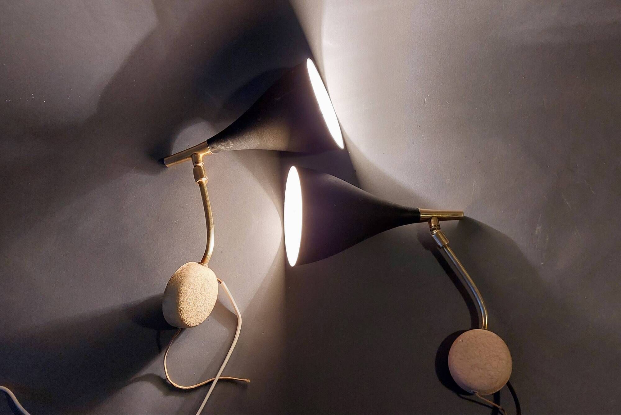 Pair of bedroom sconces in gilded brass and black aluminum 1960.