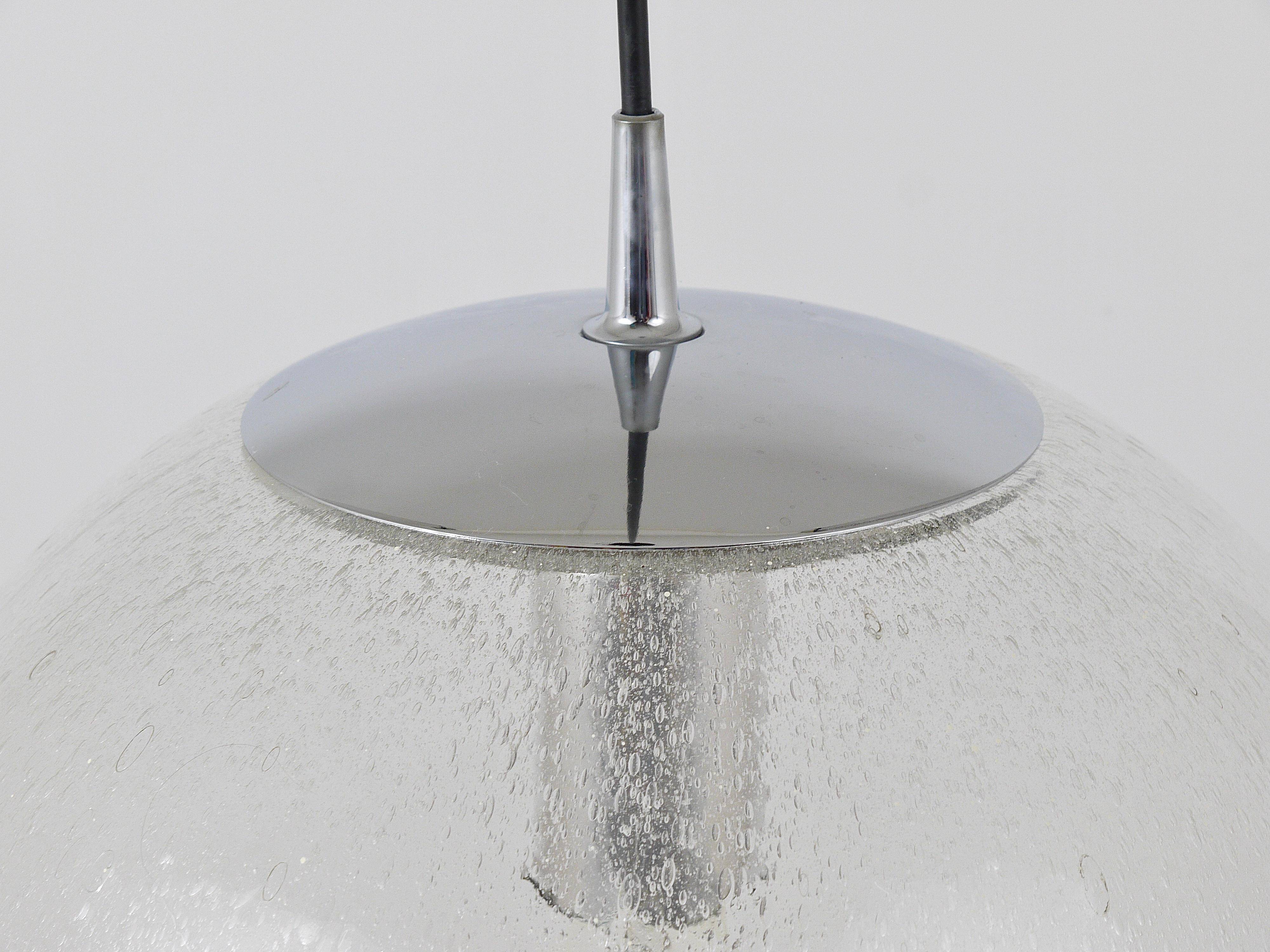 Large glass globe pendant light with bubbles and chrome by Peil & Putzler, Germany, 1970s.
