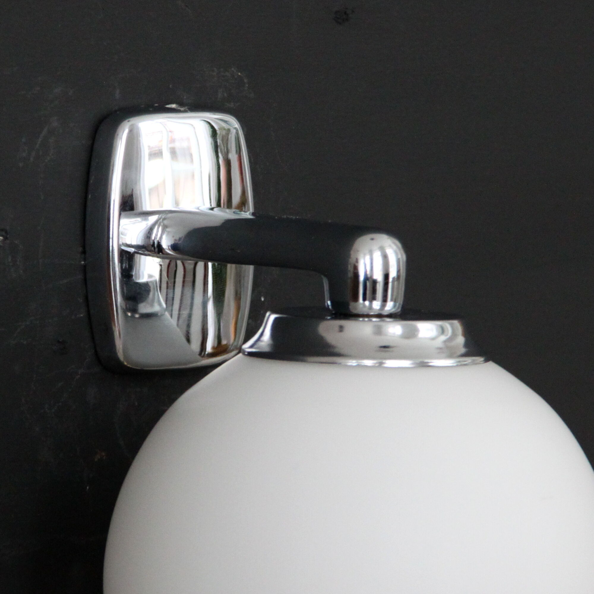 Pair of stainless steel and white glass wall sconces, seventies