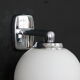 Pair of stainless steel and white glass wall sconces, seventies