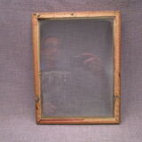 Old wooden and gilded stucco frame