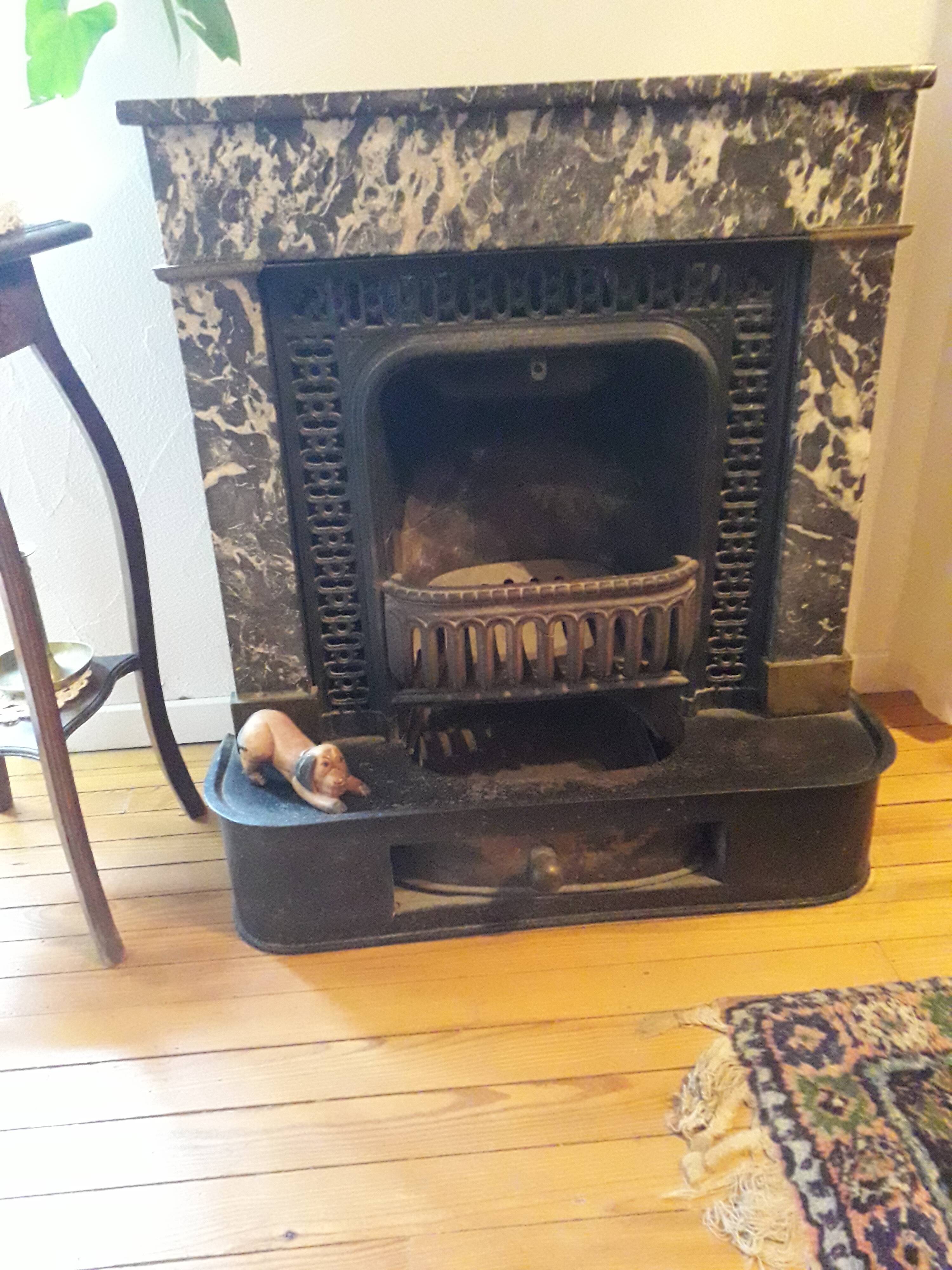 Old black marble fireplace