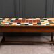 19th century oak farm table with multi-colored ceramic tiles