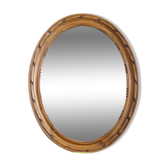 Antique oval mirror in carved wood
