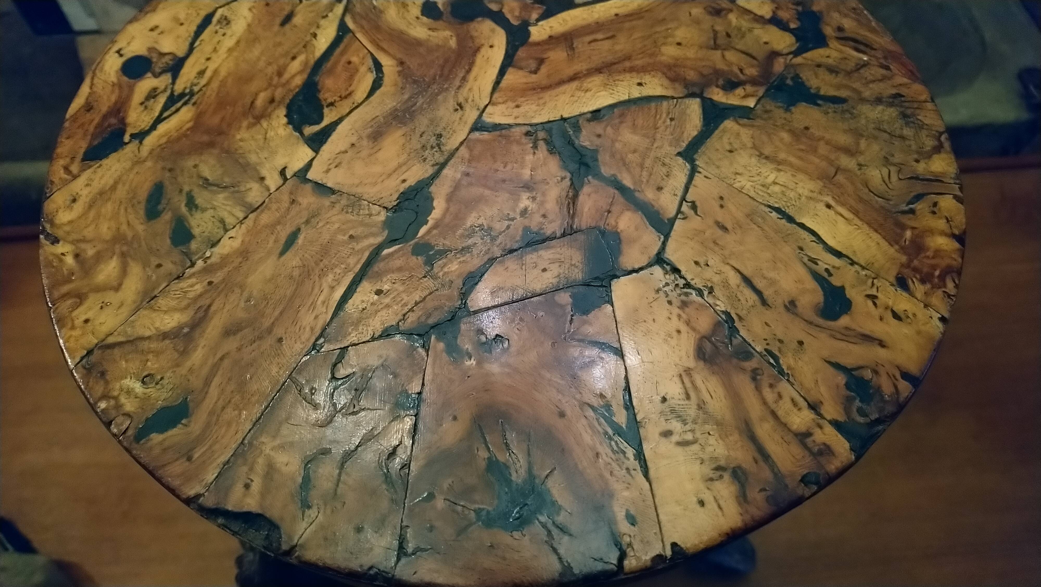 Brutalist tripod stool made from vine stumps.