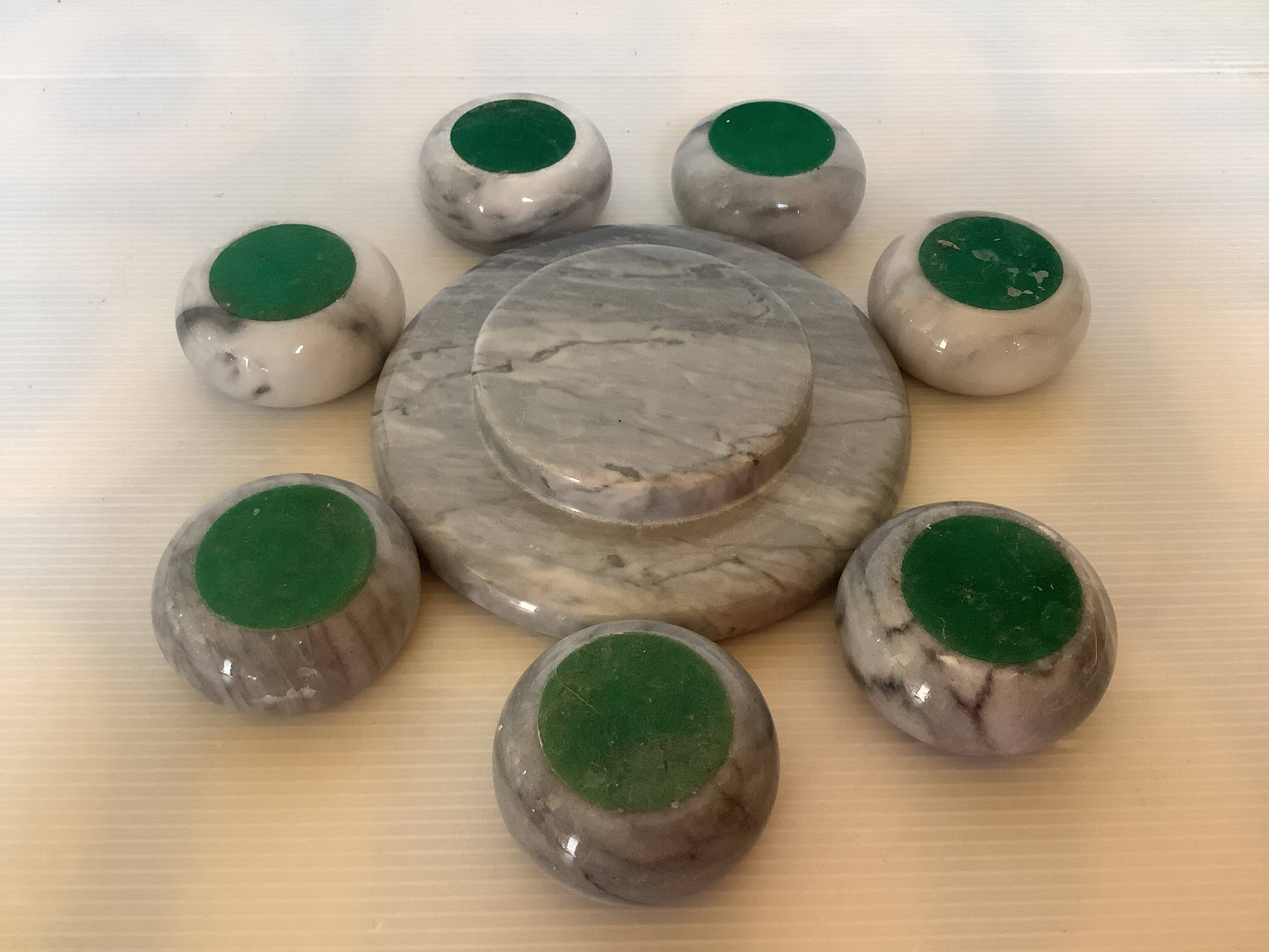 Eight grey-white marble candlesticks