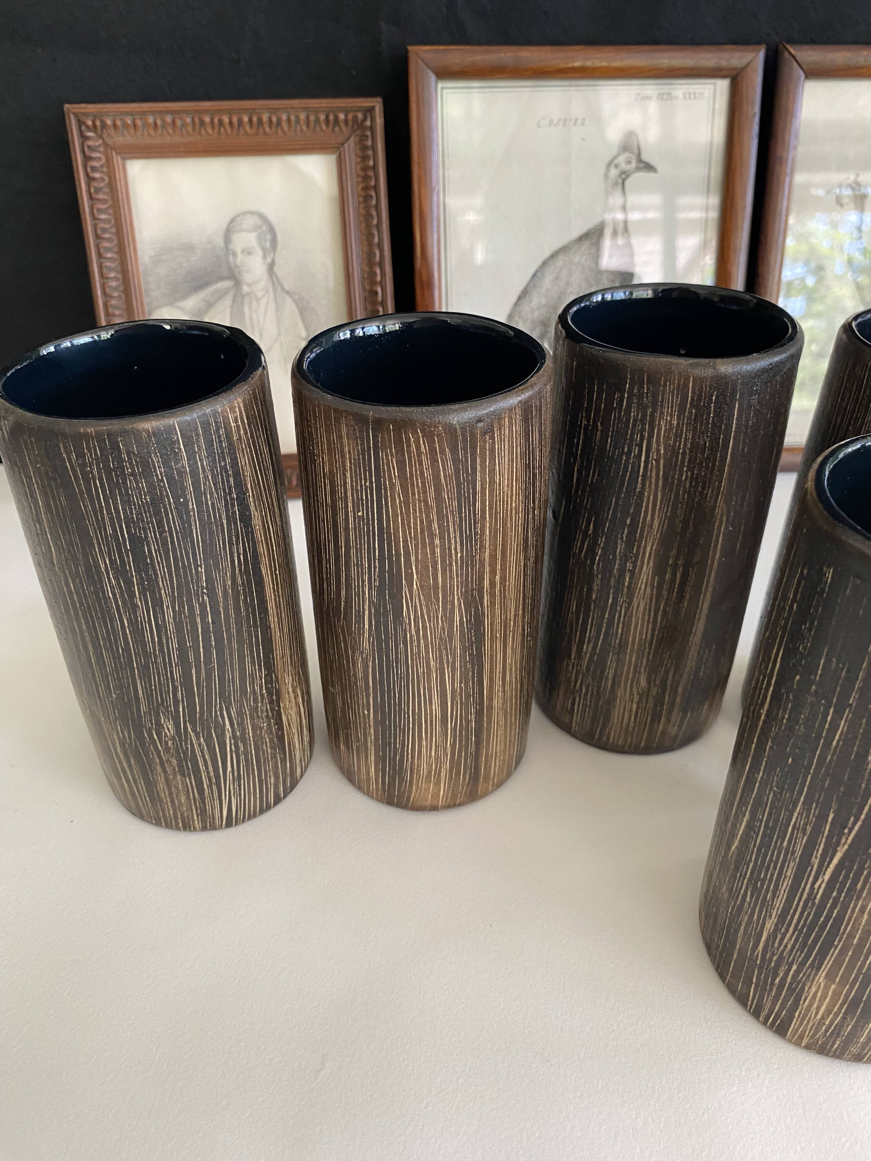 Six terracotta glasses, matt and glazed