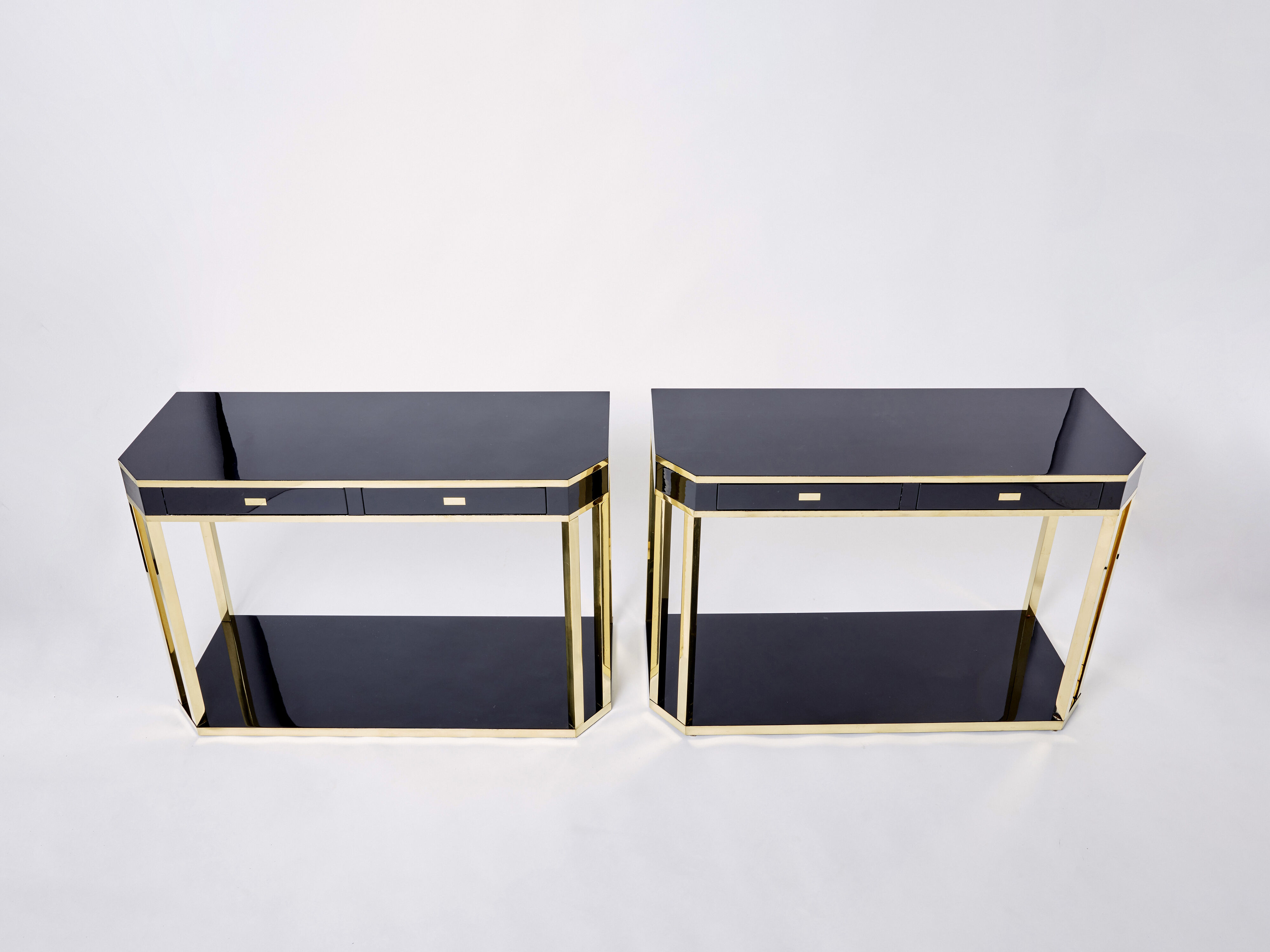 Pair of black lacquered consoles and brass 1970