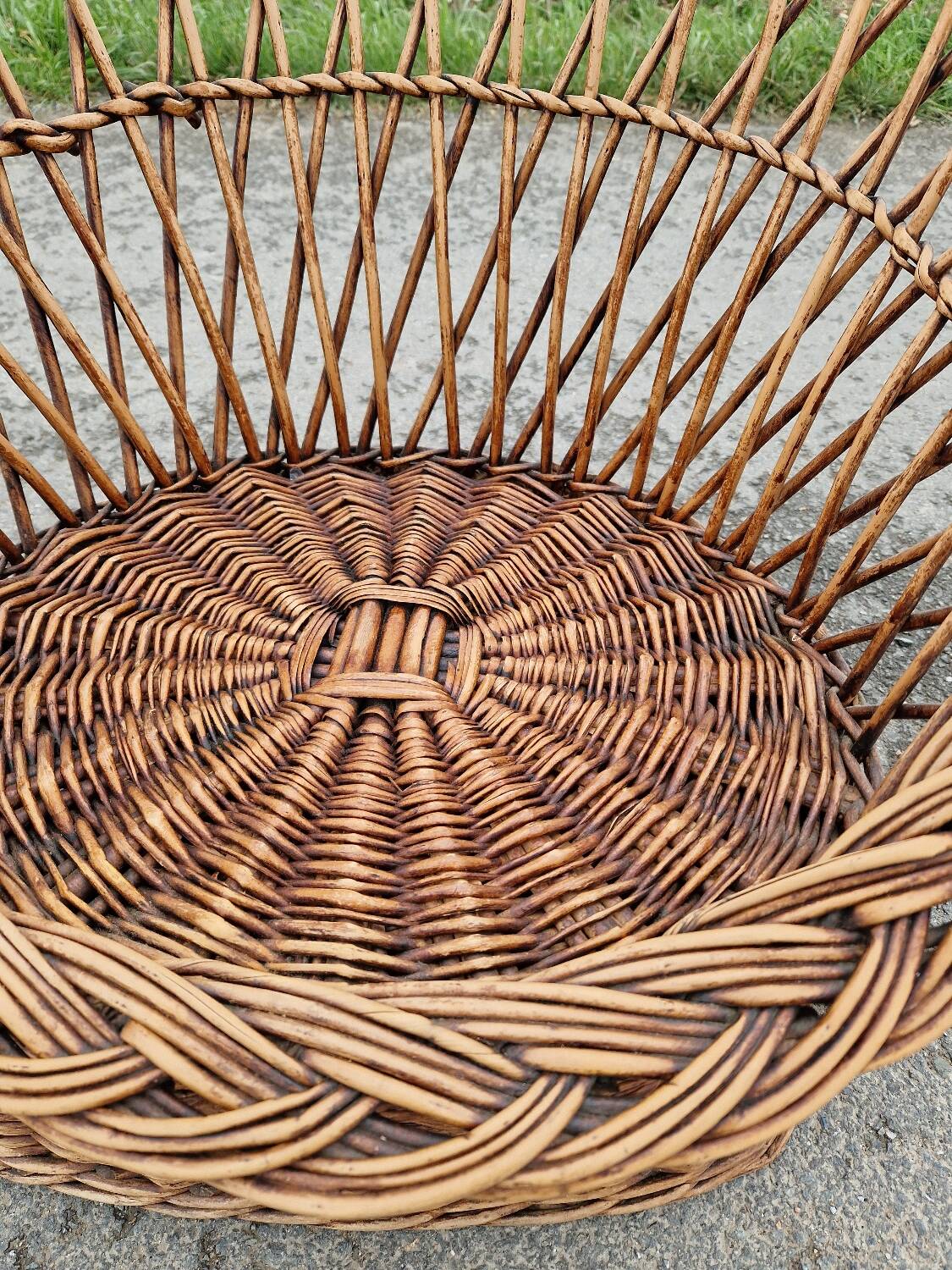Old throne basket armchair in woven wicker