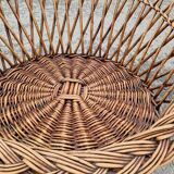 Old throne basket armchair in woven wicker