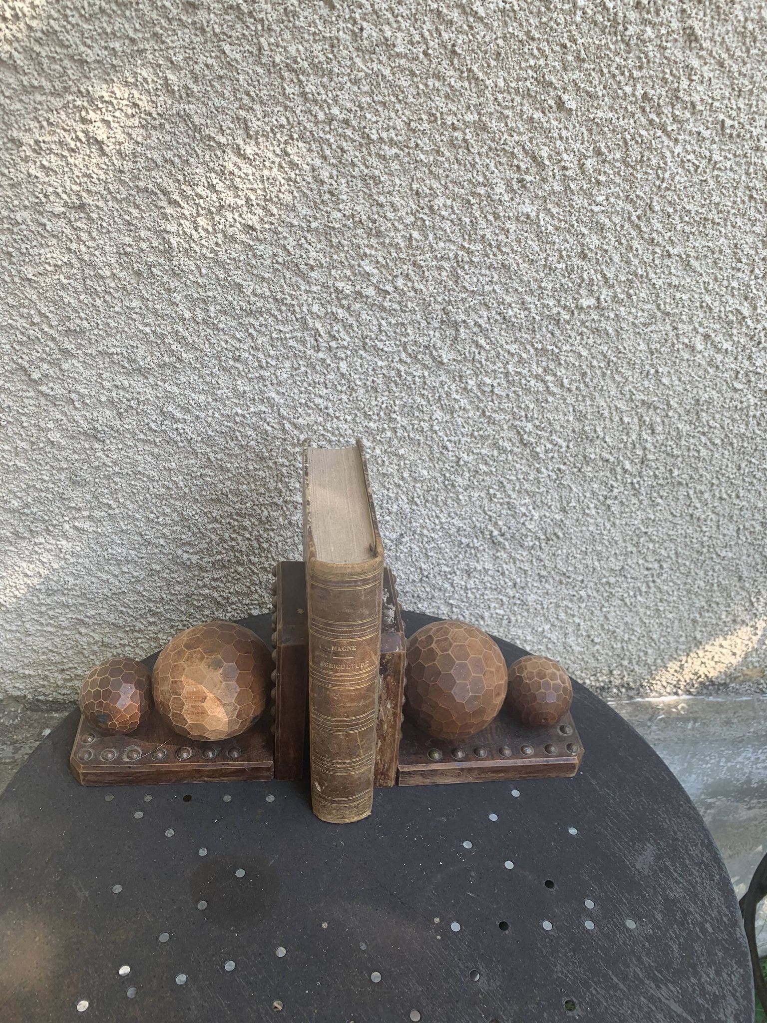 Pair of vintage carved wood and metal ball bookends