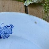 Plate decorated with blue birds and butterflies