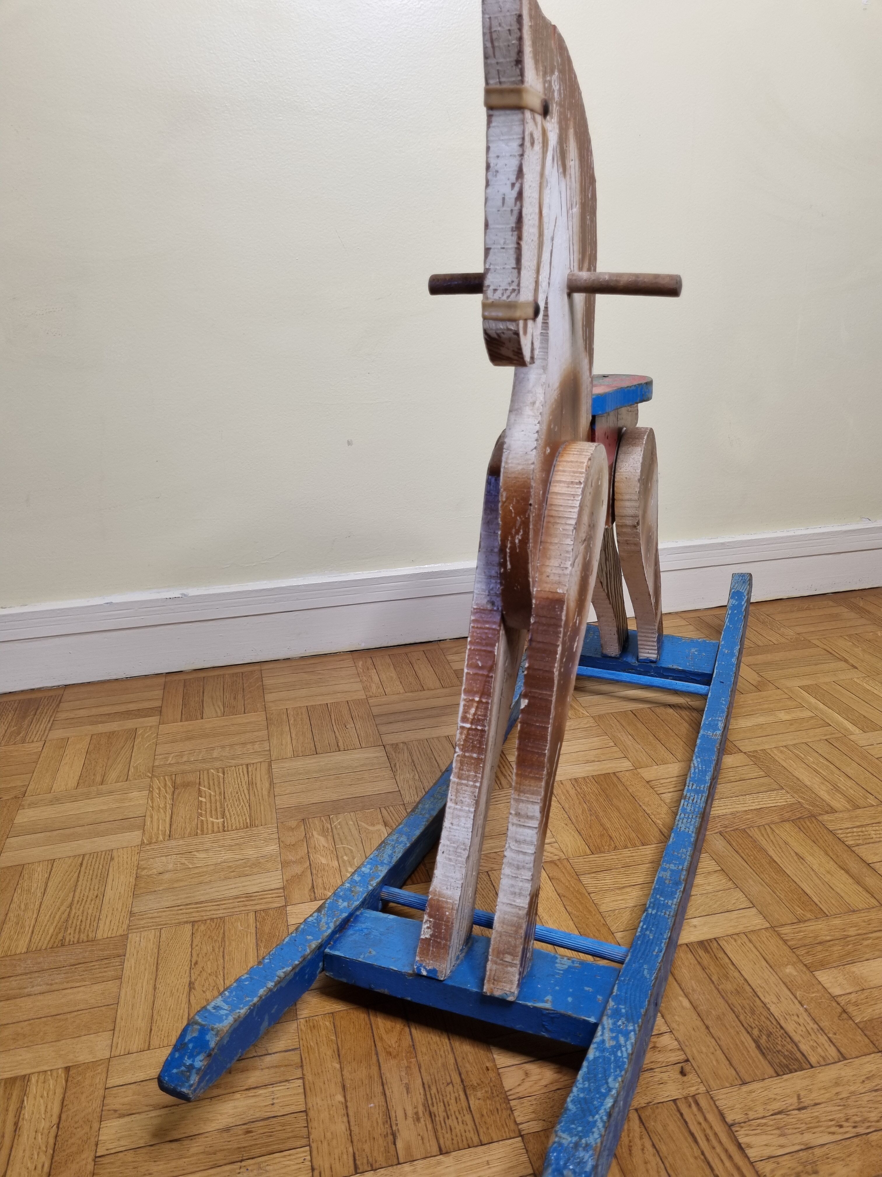 Old rocking horse in painted wood, 50s