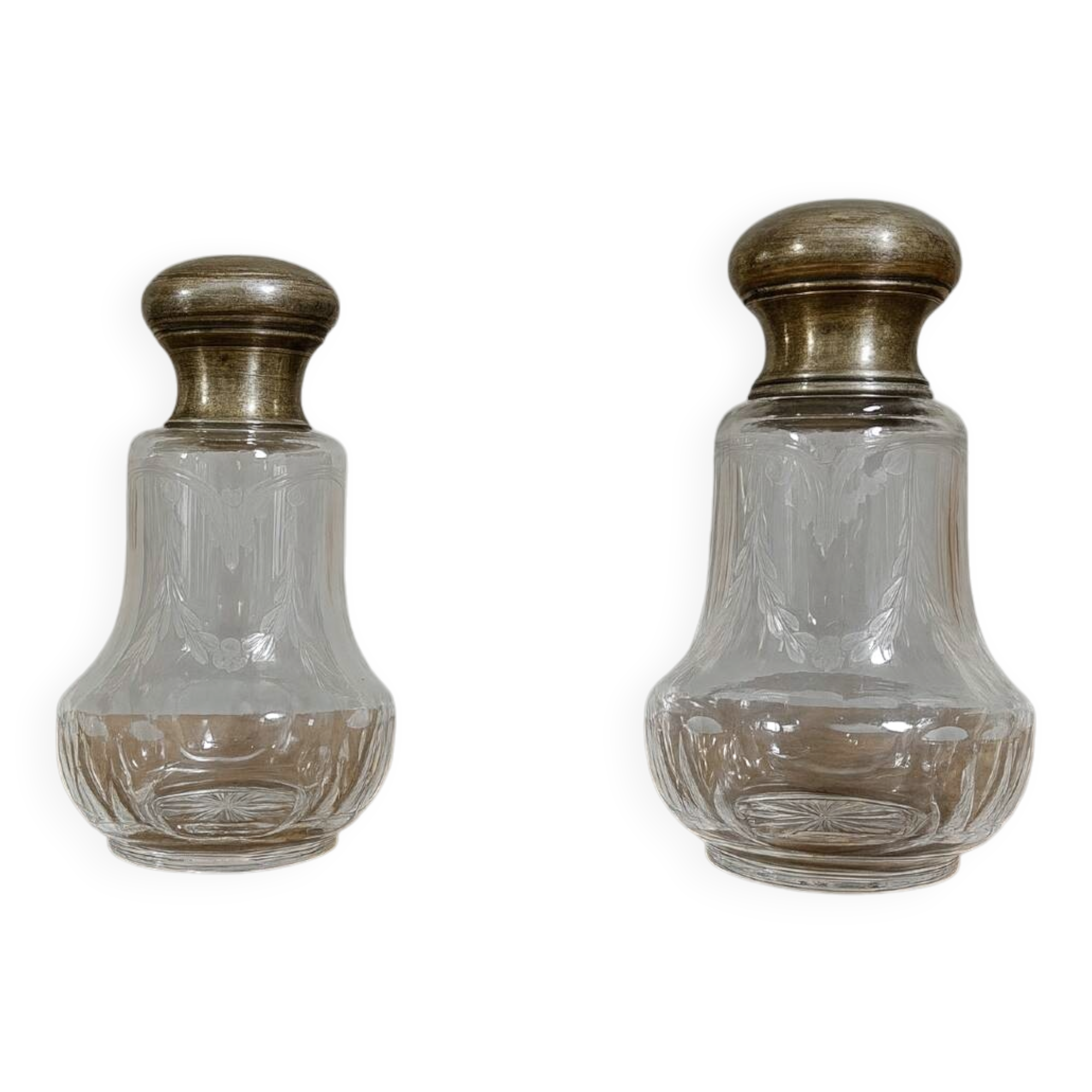 Pair of antique Louis XVI style bottles in finely engraved crystal and silver.