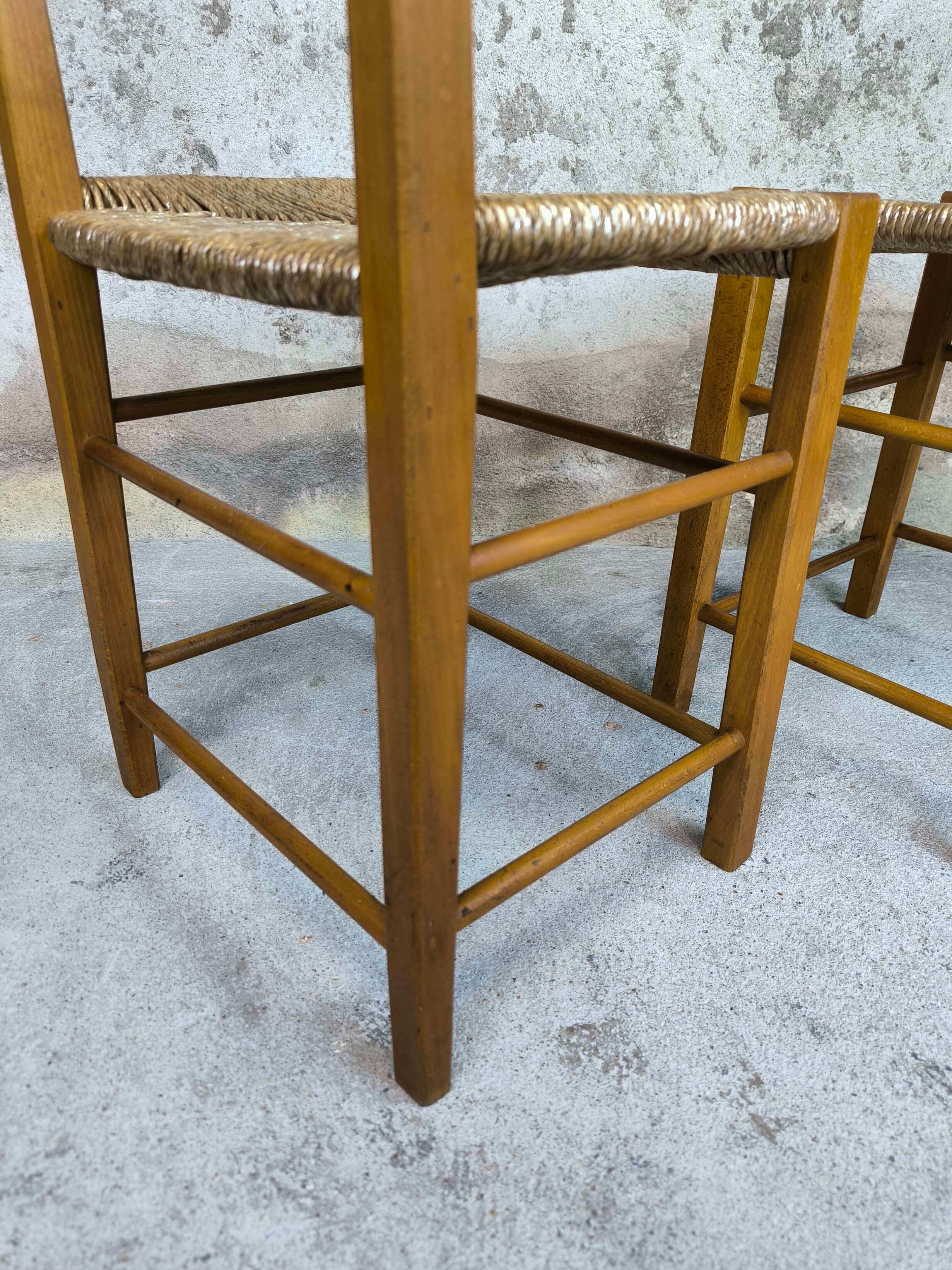 Pair of vintage wood and straw chairs