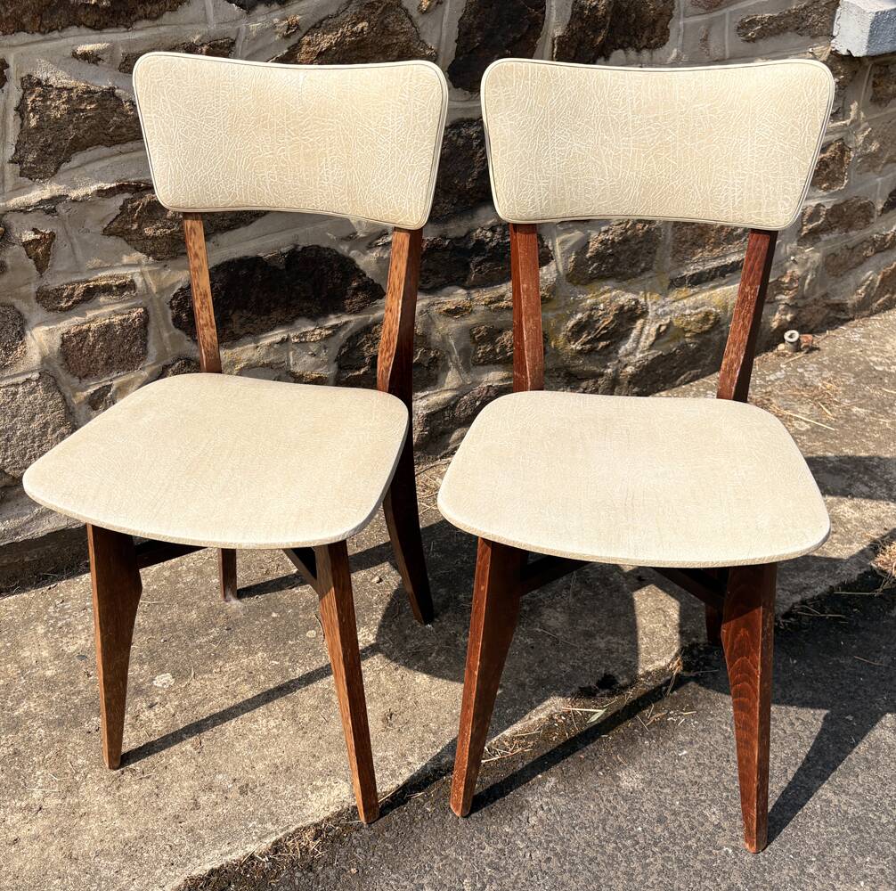 Pair of vintage chairs with upholstered backrest and seat, 1950s style.