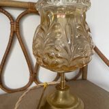 Table lamp with amber glass globe and brass base