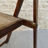 Wooden folding chair with caned seat