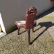 Brutalist tripod chair in wood and vintage leather