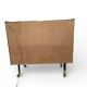 Vintage 50s-60s bar cabinet with tufted upholstery and lighting.