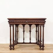 Carved walnut writer's desk in Renaissance style, late 19th century.