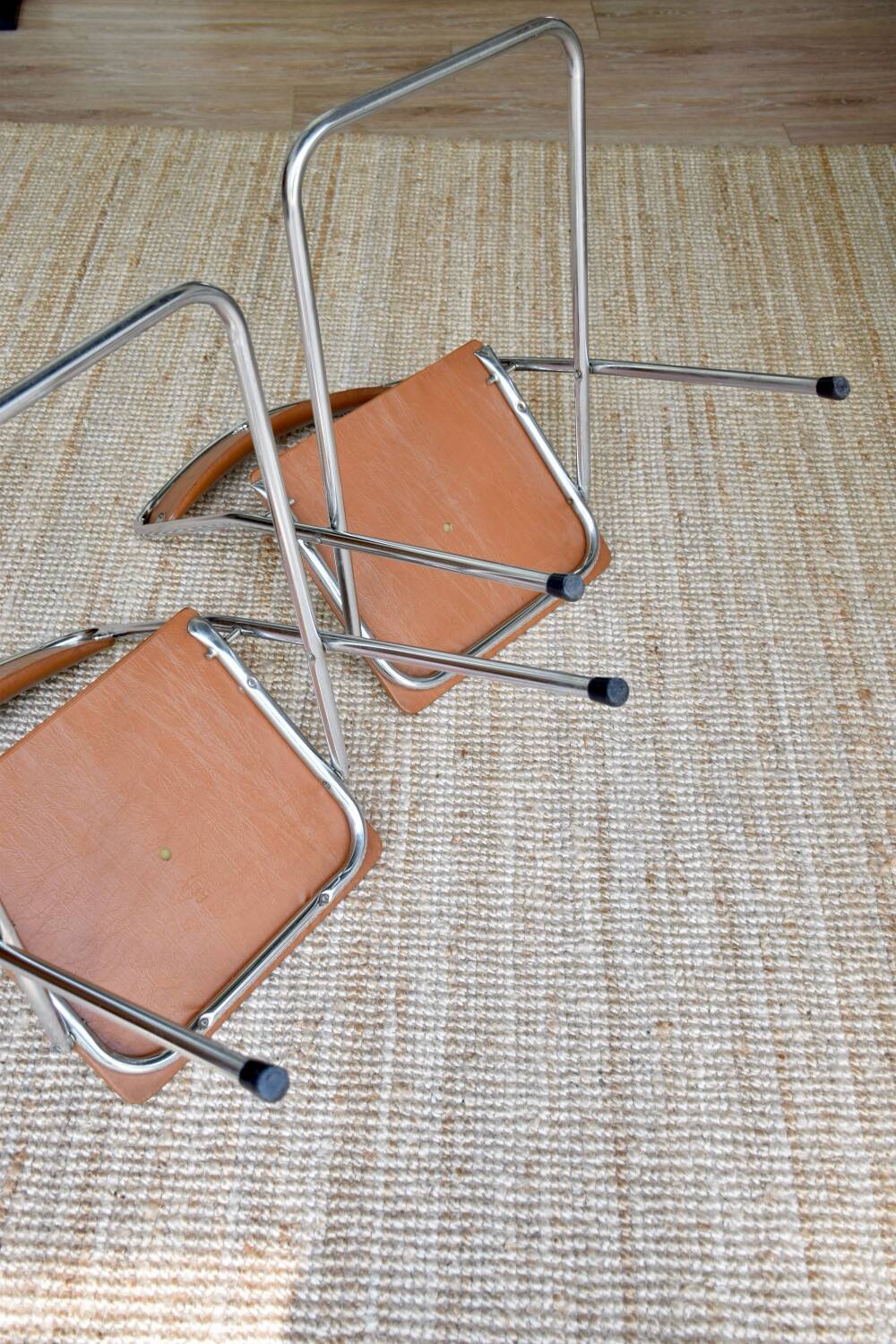 Pair of “Soudexvinyl” folding chairs in skai and chrome tube