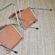 Pair of “Soudexvinyl” folding chairs in skai and chrome tube