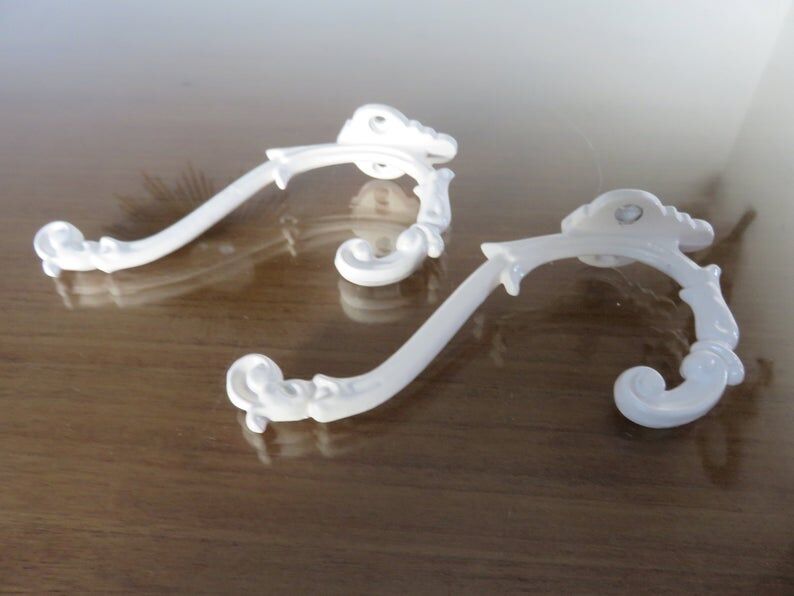 2 white cast iron pads art deco 30s 40s